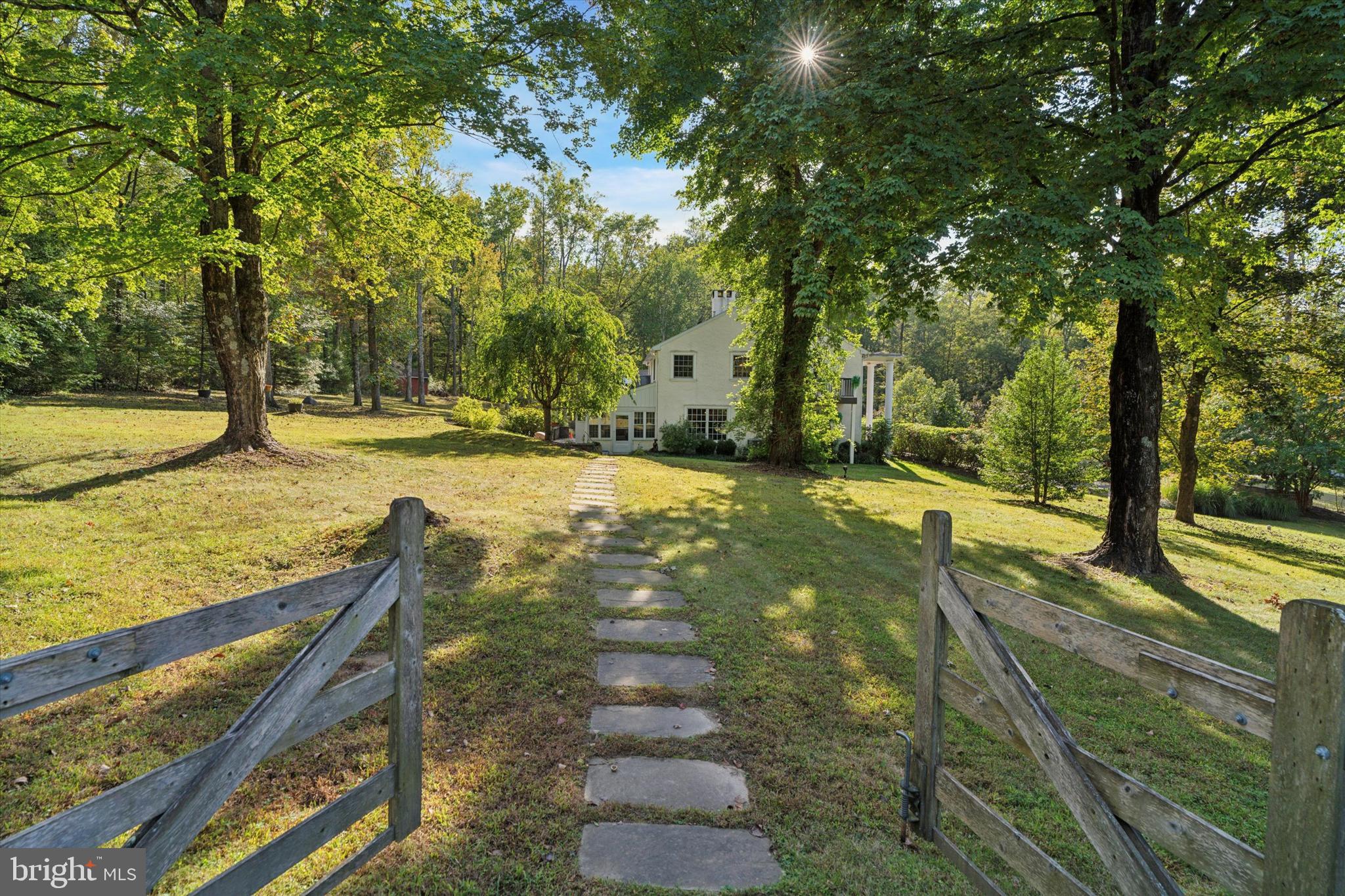 4104 Tinker Hill Road Phoenixville, PA 19460 - Photo 60 of 63 a view of a backyard with large trees