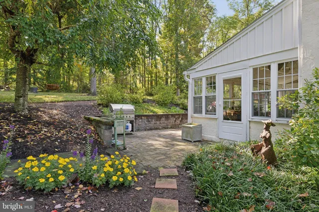 a view of backyard with outdoor seating