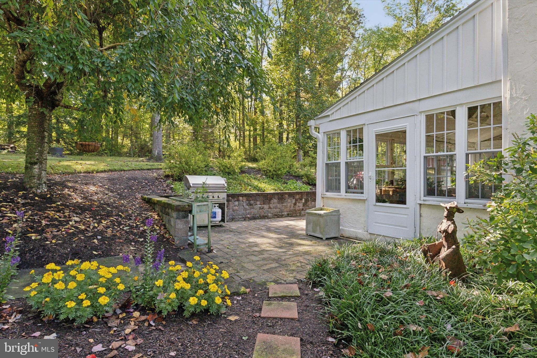 4104 Tinker Hill Road Phoenixville, PA 19460 - Photo 9 of 63 a view of a house with a yard and sitting area