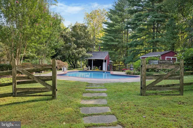 a view of backyard with outdoor seating