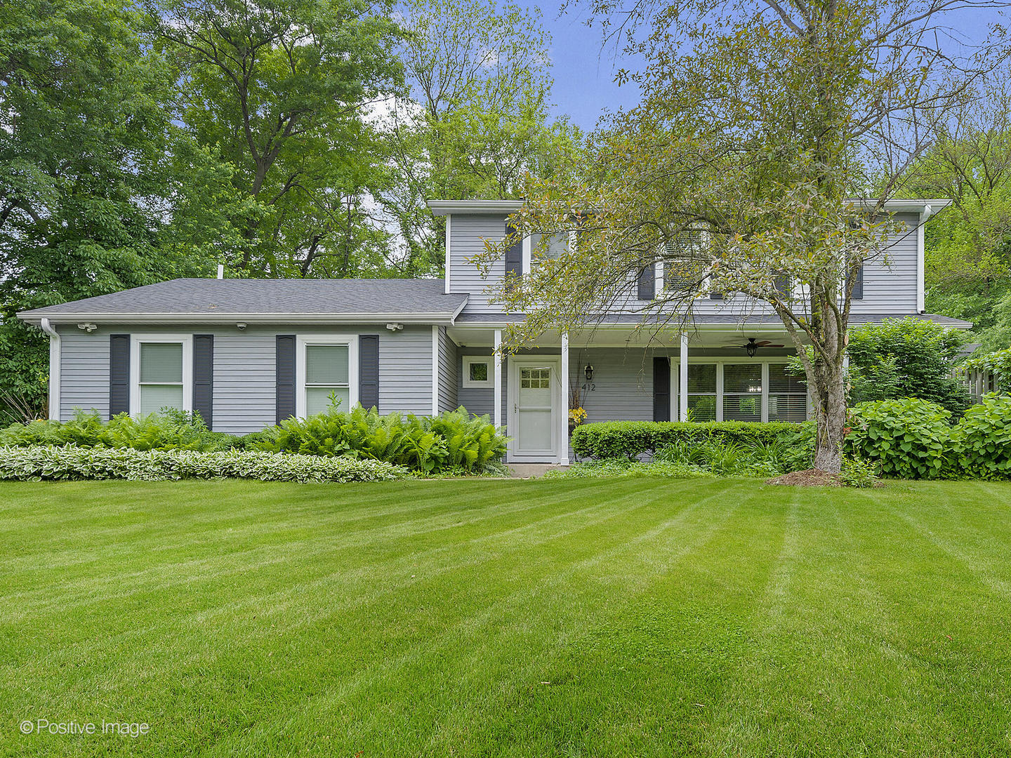 N412 Indian Knoll Road West Chicago, IL 60185 - Photo 1 of 25 a front view of a house with a yard