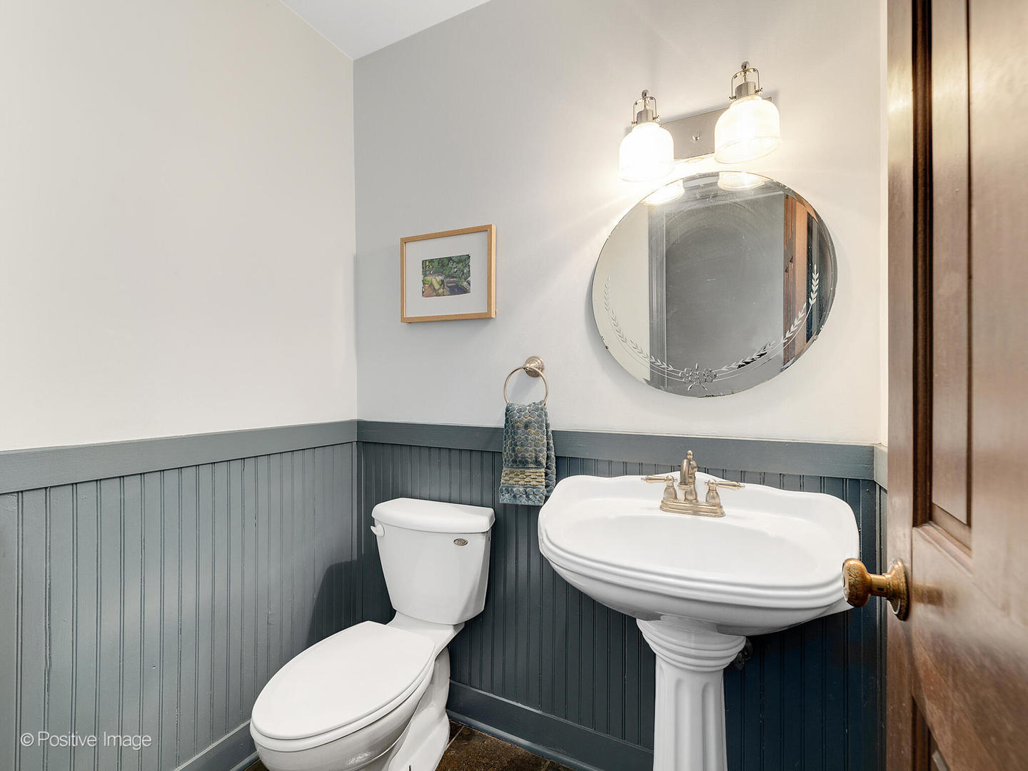 N412 Indian Knoll Road West Chicago, IL 60185 - Photo 16 of 25 a bathroom with a toilet sink and mirror