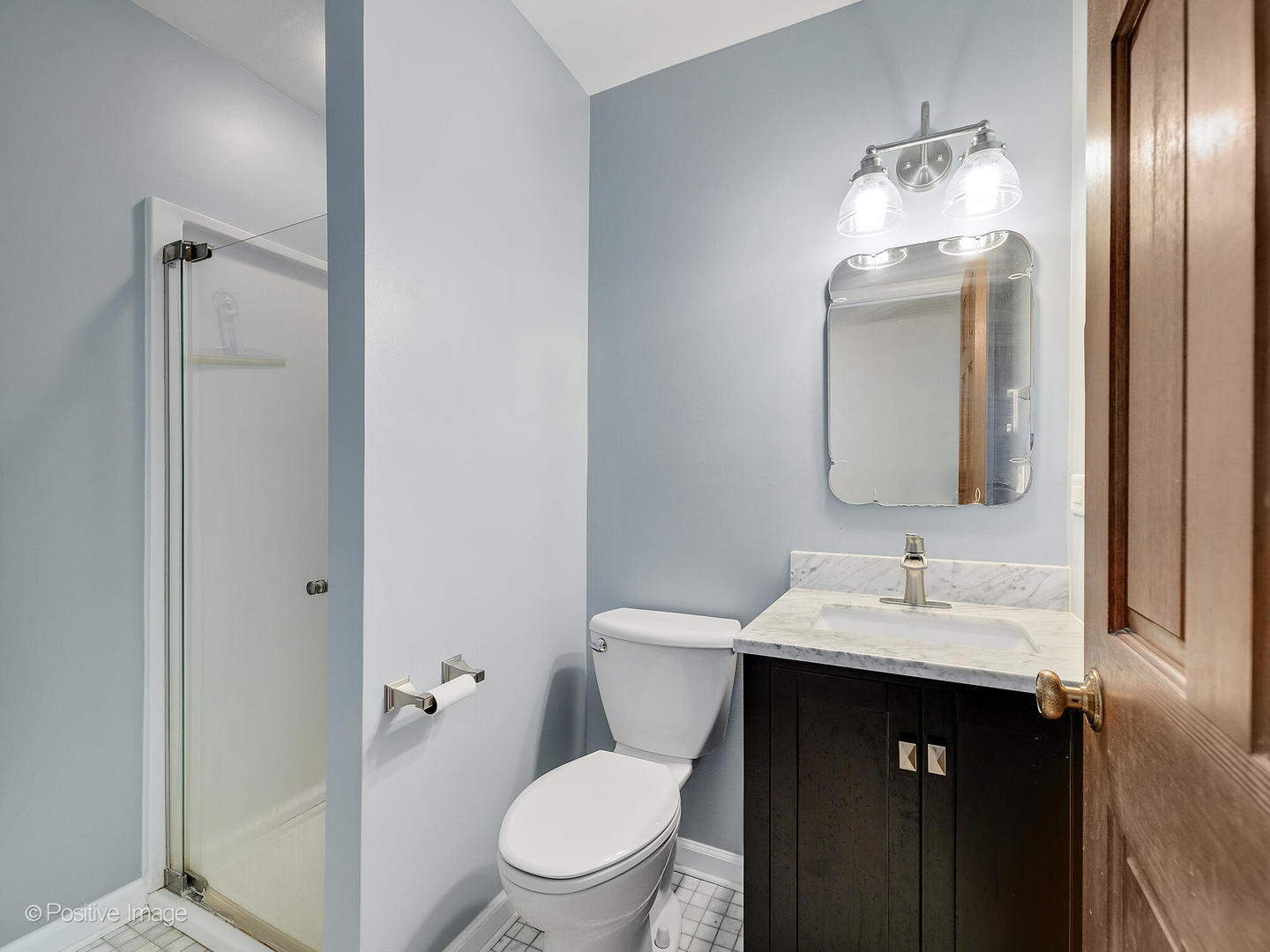 N412 Indian Knoll Road West Chicago, IL 60185 - Photo 20 of 25 a bathroom with a toilet sink and mirror