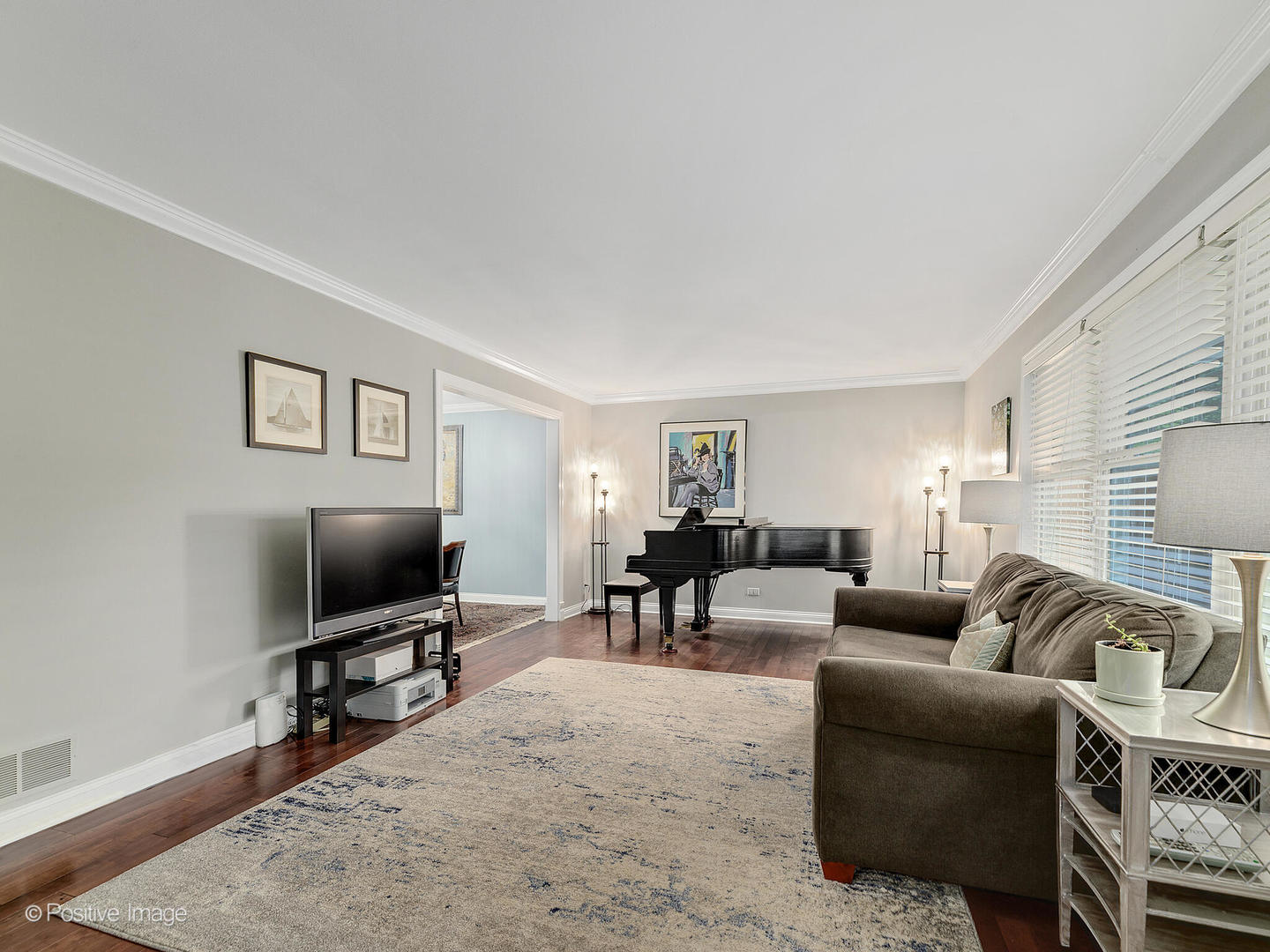 N412 Indian Knoll Road West Chicago, IL 60185 - Photo 6 of 25 a living room with furniture and a flat screen tv