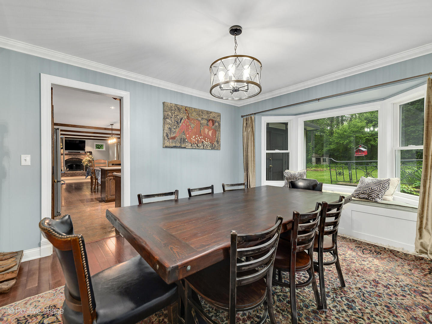 N412 Indian Knoll Road West Chicago, IL 60185 - Photo 7 of 25 a view of a dining room with furniture wooden floor and chandelier