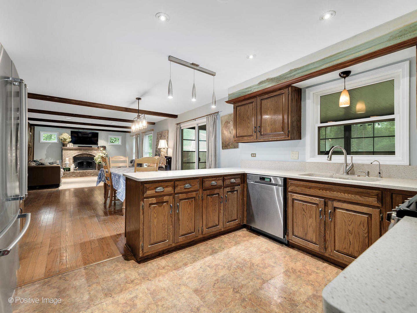 N412 Indian Knoll Road West Chicago, IL 60185 - Photo 9 of 25 a kitchen with stainless steel appliances granite countertop a sink and cabinets