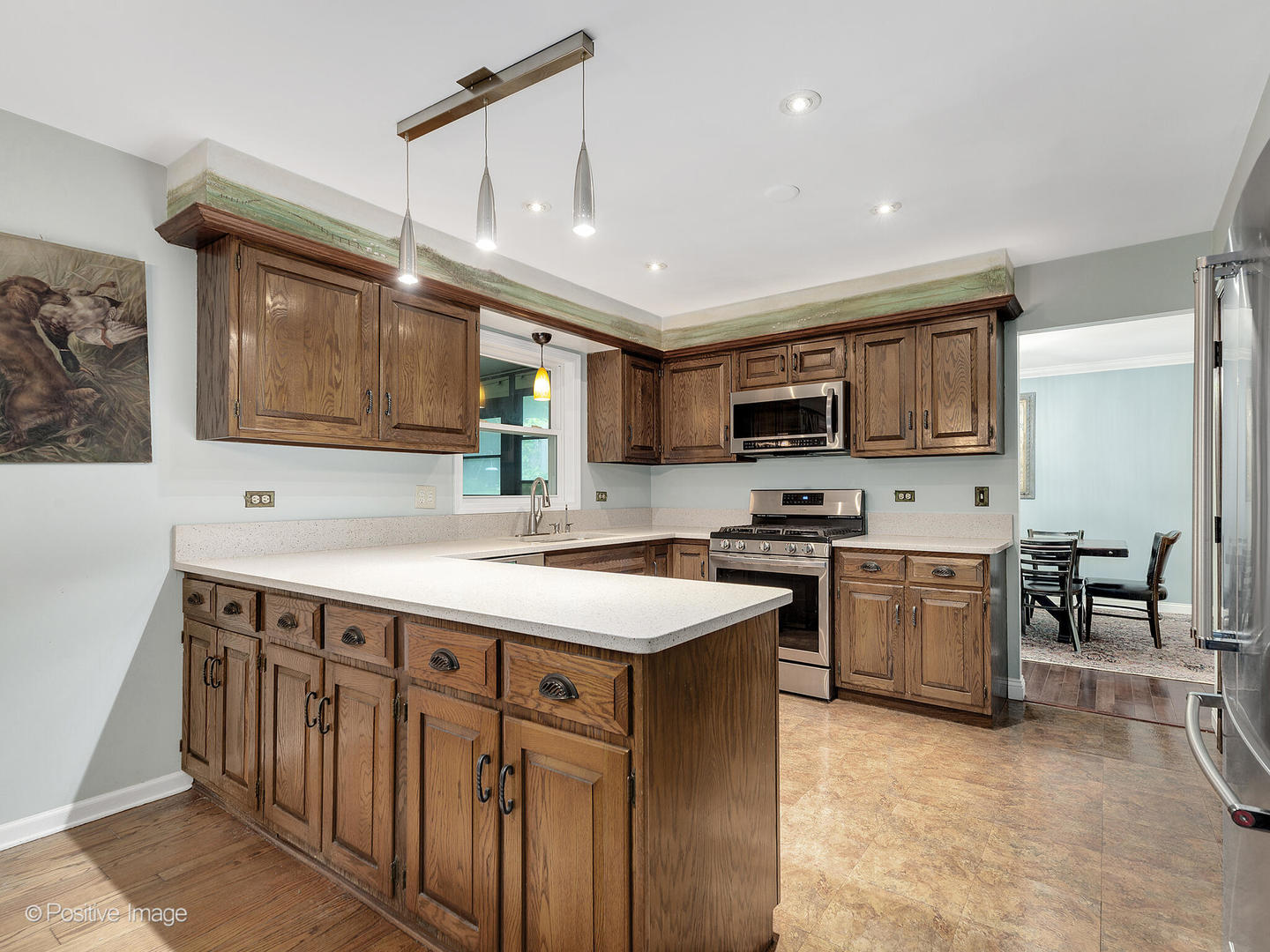 N412 Indian Knoll Road West Chicago, IL 60185 - Photo 10 of 25 a kitchen with a sink stove and microwave