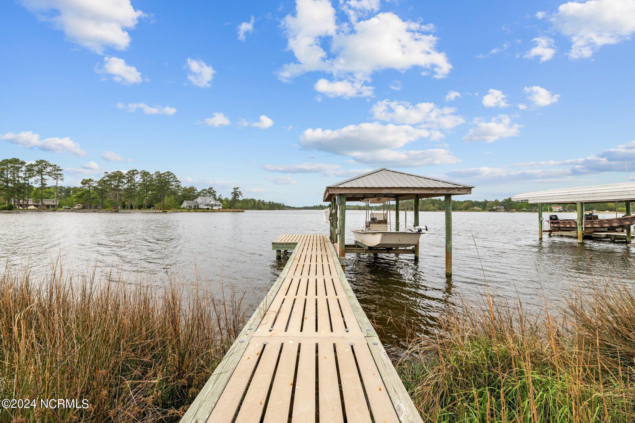 3772 Janiero Road Arapahoe, NC 28510 - Photo 10 of 54 Hog Slat concrete dock with covered boat lift and seawall