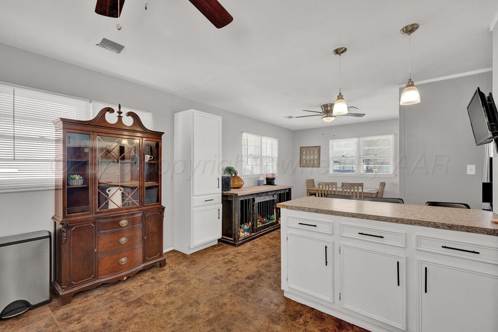 5016 Leigh Avenue Amarillo, TX 79110 - Photo 11 of 21 a kitchen with a sink and refrigerator