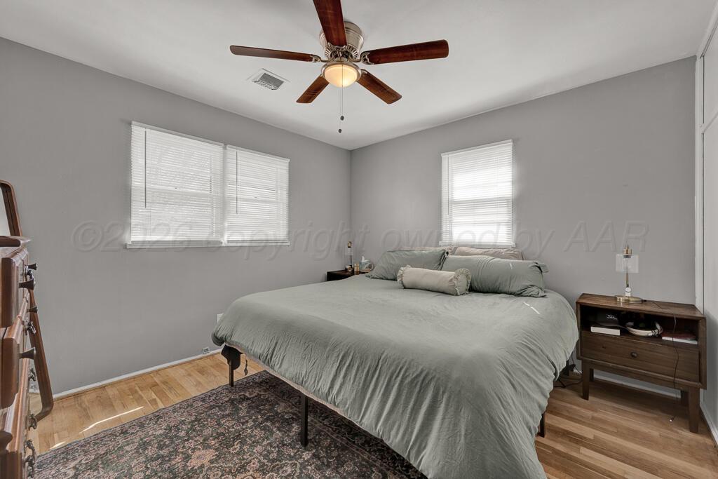 5016 Leigh Avenue Amarillo, TX 79110 - Photo 13 of 21 a bedroom with bed and a window