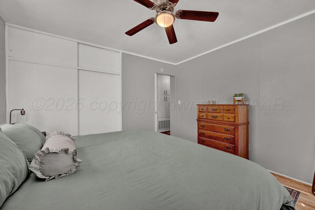 5016 Leigh Avenue Amarillo, TX 79110 - Photo 14 of 21 a bedroom with a bed and closet