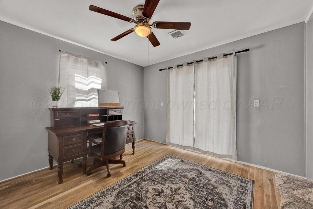 5016 Leigh Avenue Amarillo, TX 79110 - Photo 17 of 21 a workspace with chandelier