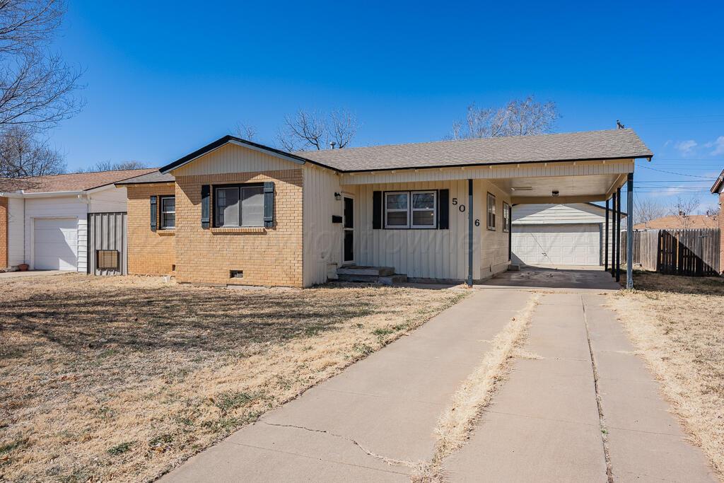 5016 Leigh Avenue Amarillo, TX 79110 - Photo 2 of 21 a front view of a house with a yard and garage
