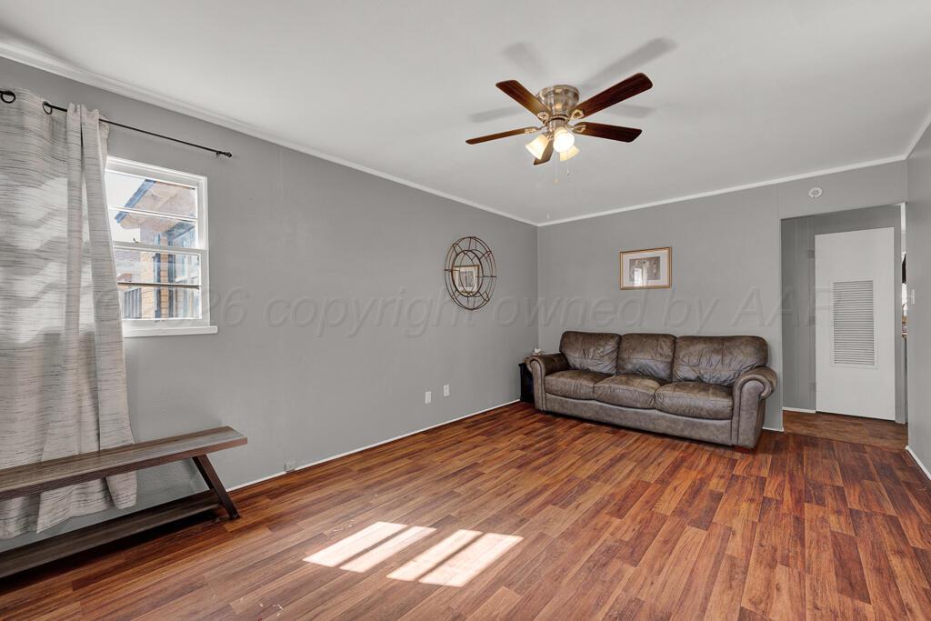 5016 Leigh Avenue Amarillo, TX 79110 - Photo 5 of 21 a living room with furniture and a wooden floor
