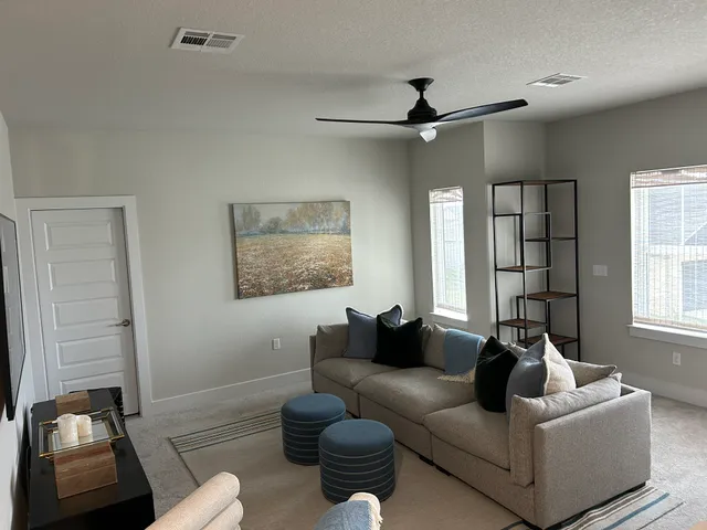 a living room with furniture and a window