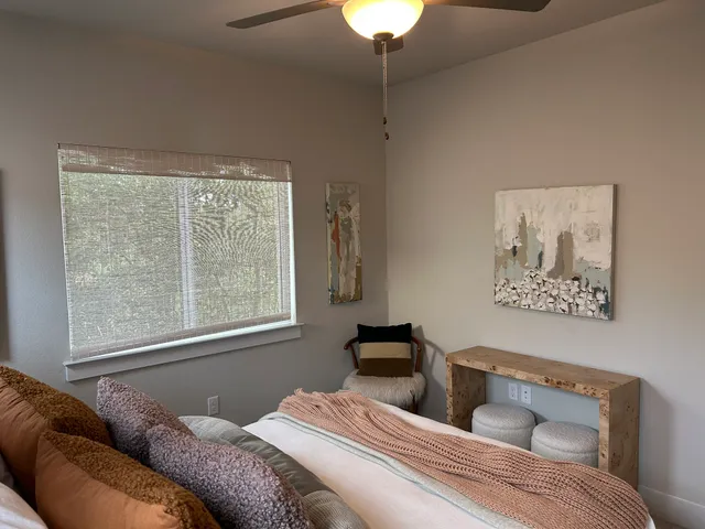 a bedroom with a bed and a couch