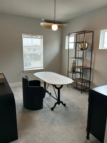 a view of a livingroom with furniture and window