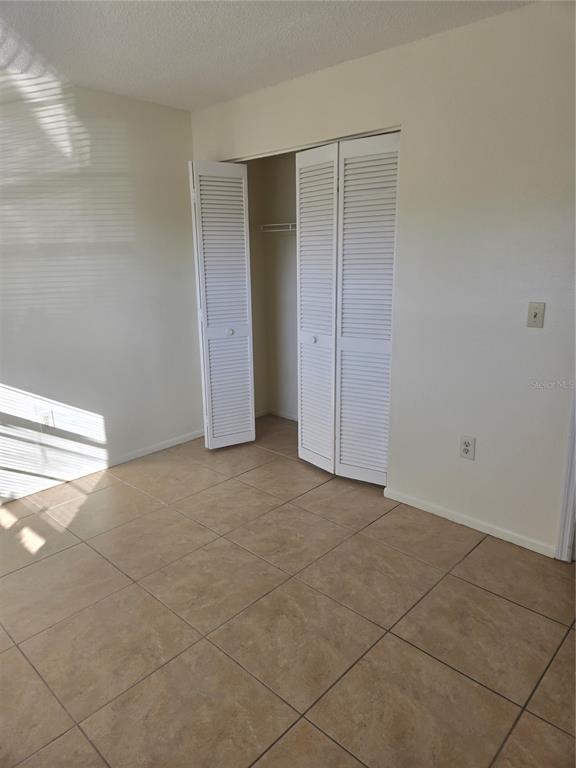 1313 54th Avenue East, Unit 1313 Bradenton, FL 34203 - Photo 12 of 17 a view of an empty room and entryway