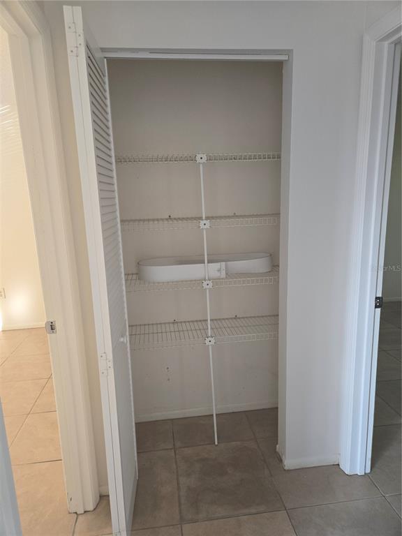 1313 54th Avenue East, Unit 1313 Bradenton, FL 34203 - Photo 13 of 17 a bathroom with a shower