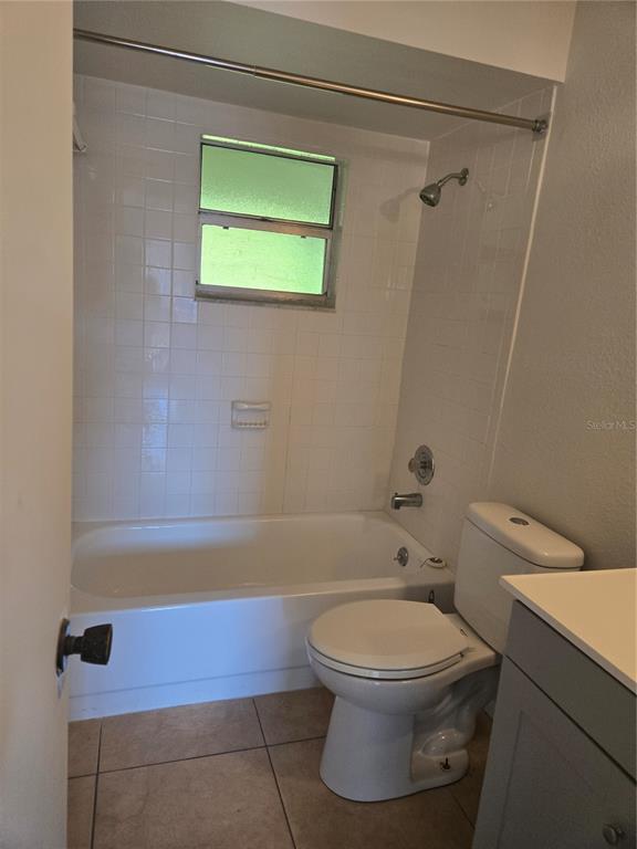 1313 54th Avenue East, Unit 1313 Bradenton, FL 34203 - Photo 15 of 17 a bathroom with a toilet and a shower