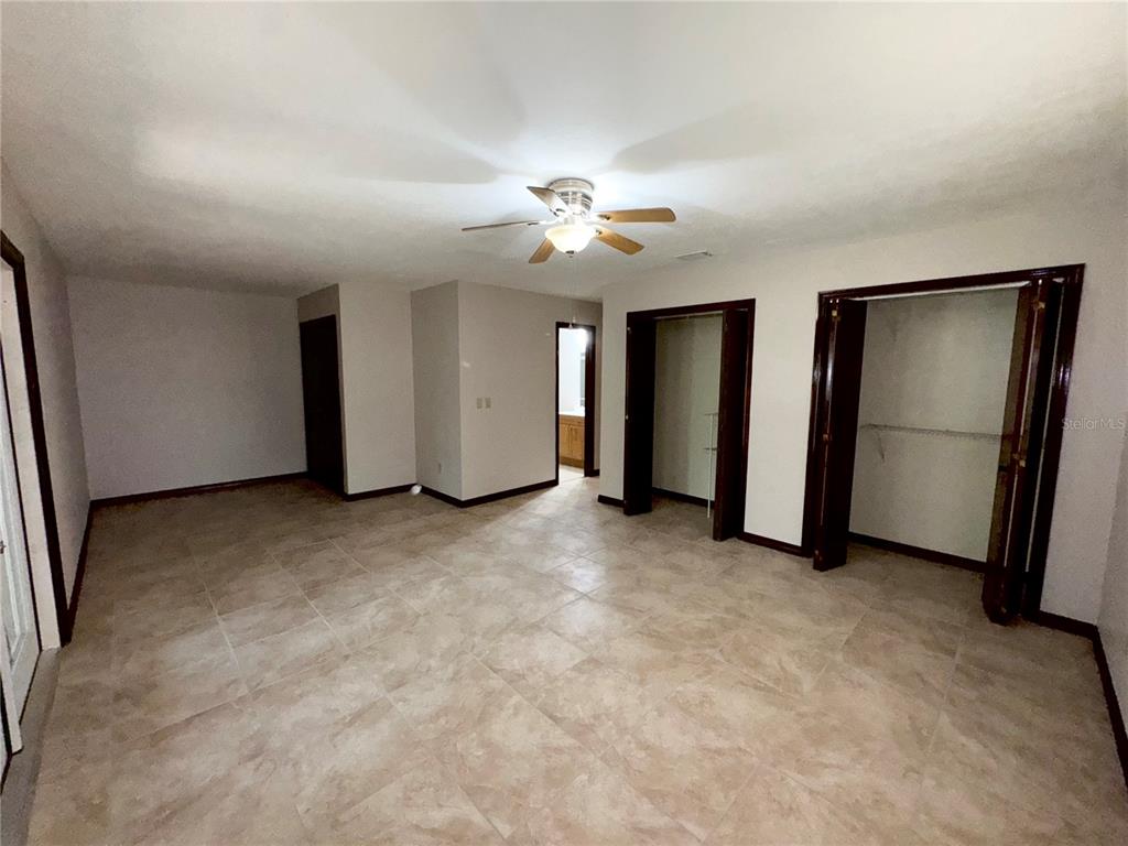 4300 Northeast 17th Terrace Gainesville, FL 32609 - Photo 17 of 21 a view of empty room with ceiling fan