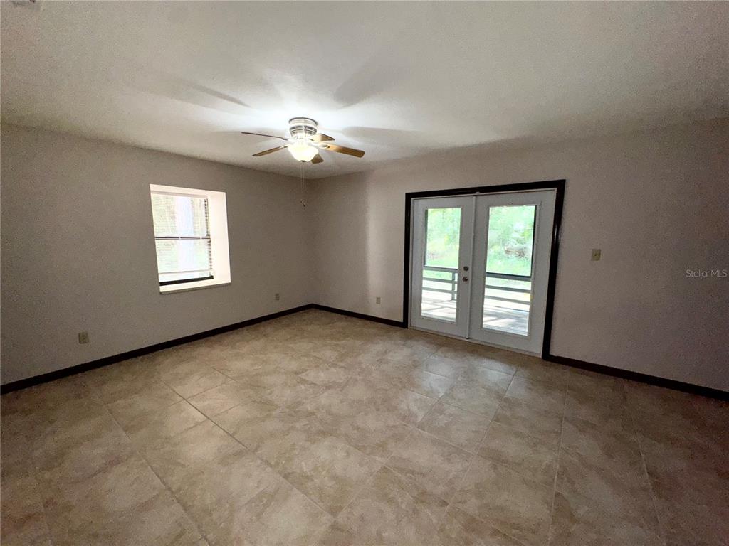4300 Northeast 17th Terrace Gainesville, FL 32609 - Photo 18 of 21 an empty room with windows