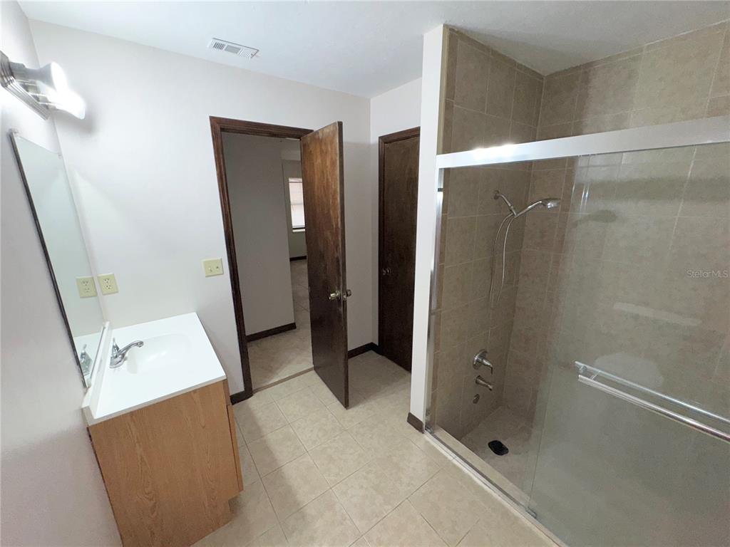 4300 Northeast 17th Terrace Gainesville, FL 32609 - Photo 19 of 21 a bathroom with a shower and a sink