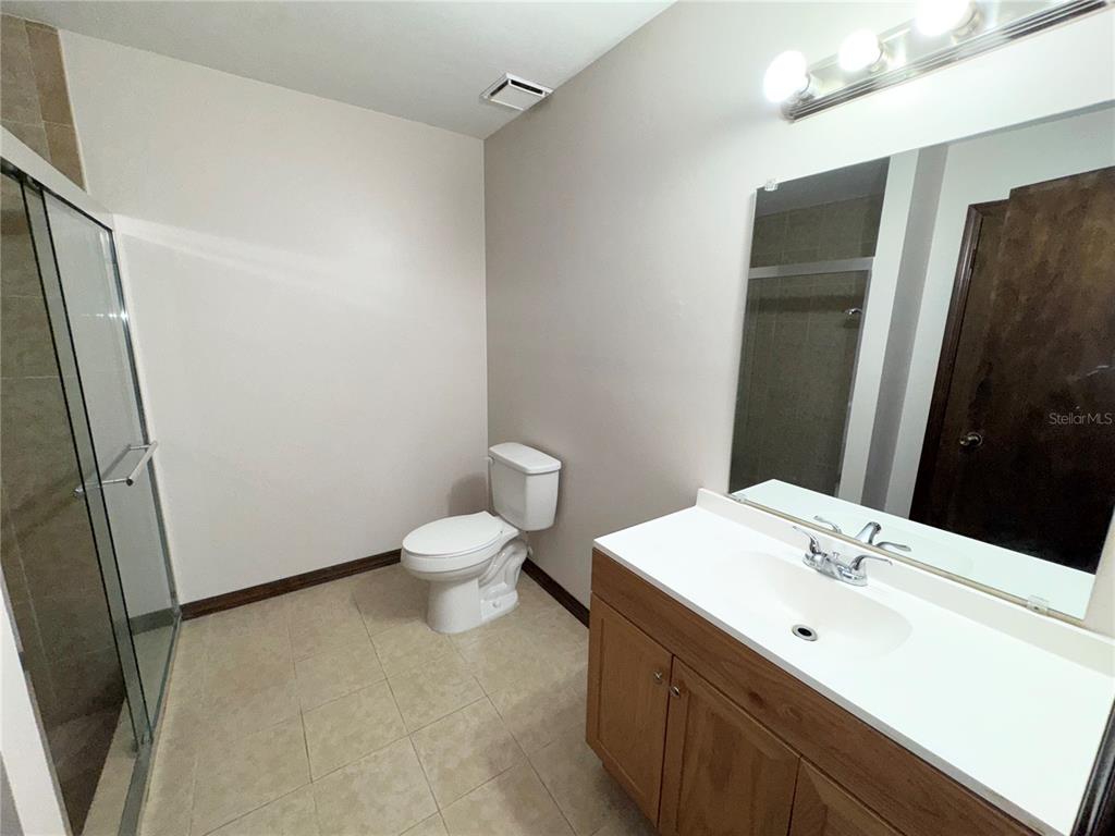 4300 Northeast 17th Terrace Gainesville, FL 32609 - Photo 20 of 21 a bathroom with a sink and a mirror