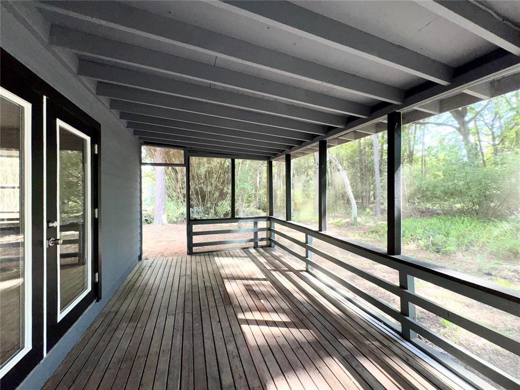 4300 Northeast 17th Terrace Gainesville, FL 32609 - Photo 21 of 21 a view of a room with wooden floor and city view