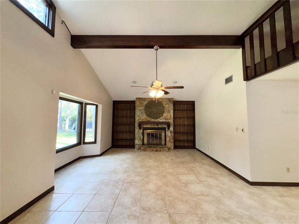 4300 Northeast 17th Terrace Gainesville, FL 32609 - Photo 4 of 21 a view of a livingroom with furniture and chandelier