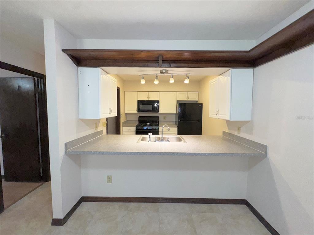 4300 Northeast 17th Terrace Gainesville, FL 32609 - Photo 7 of 21 a view of kitchen with cabinets and outdoor view