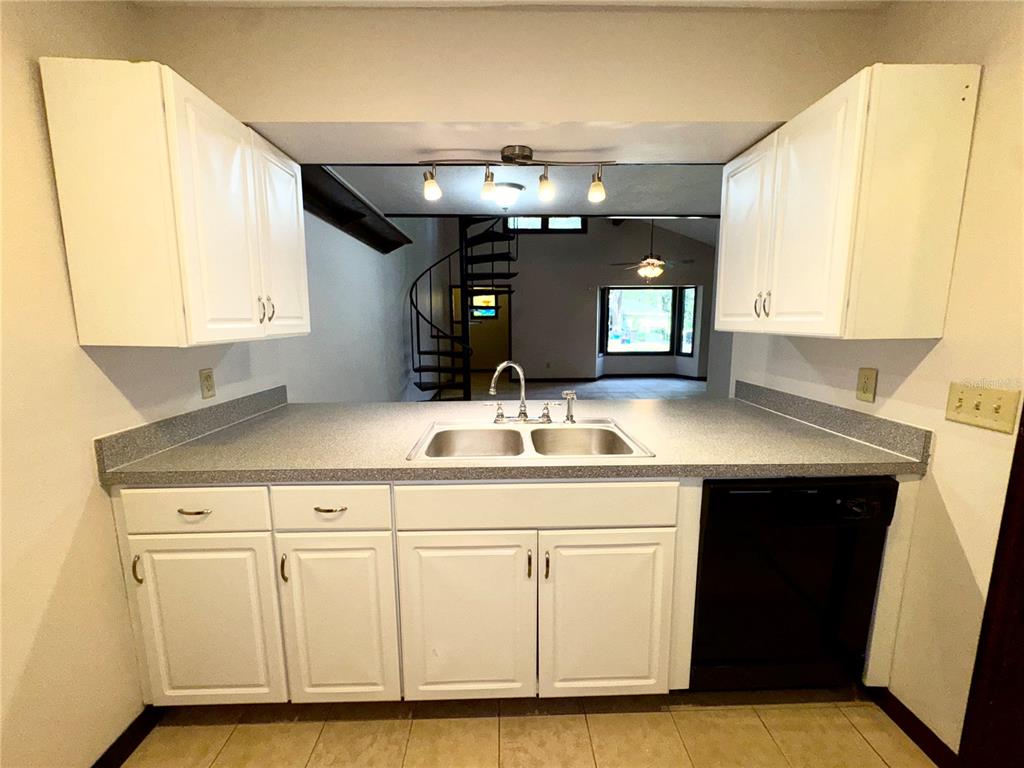 4300 Northeast 17th Terrace Gainesville, FL 32609 - Photo 9 of 21 a bathroom with a sink and a mirror