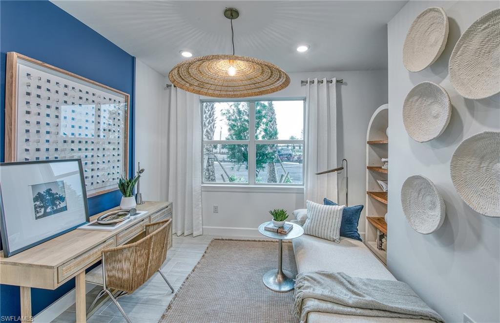 12669 Pyrite Court Alva, FL 33920 - Photo 12 of 13 a living room with furniture and a large window