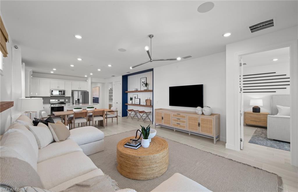 12669 Pyrite Court Alva, FL 33920 - Photo 3 of 13 a living room with furniture and a flat screen tv