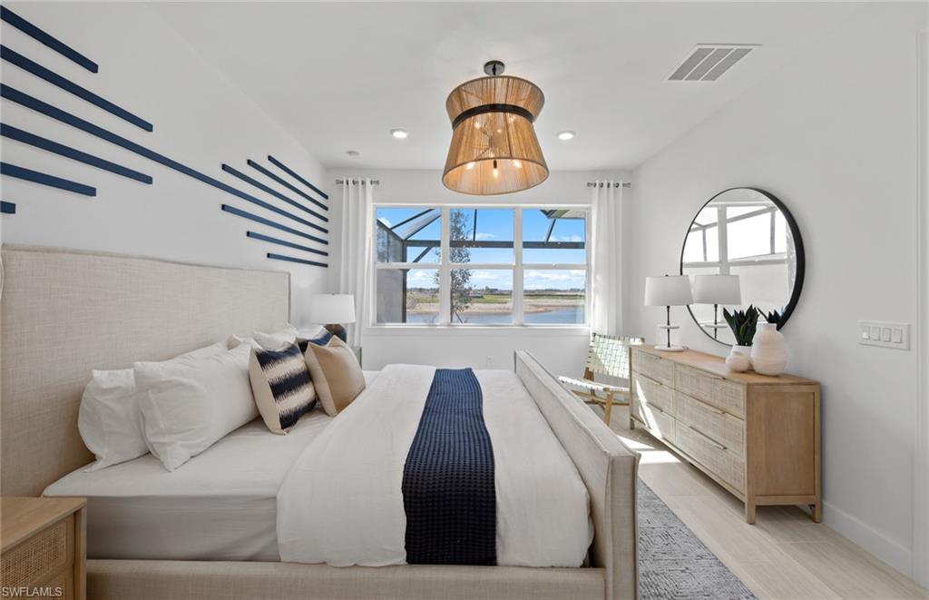 12669 Pyrite Court Alva, FL 33920 - Photo 10 of 13 a bedroom with a bed and window