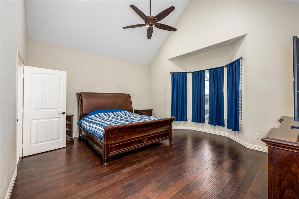 5033 Brook Lane Anna, TX 75409 - Photo 11 of 35 a view of a livingroom with wooden floor and a ceiling fan