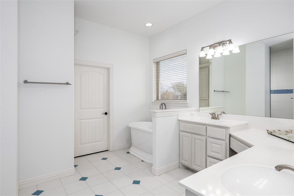 5033 Brook Lane Anna, TX 75409 - Photo 12 of 35 a spacious bathroom with a bathtub sink and mirror