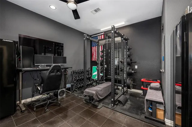 a living room with furniture a air conditioner vent and a window