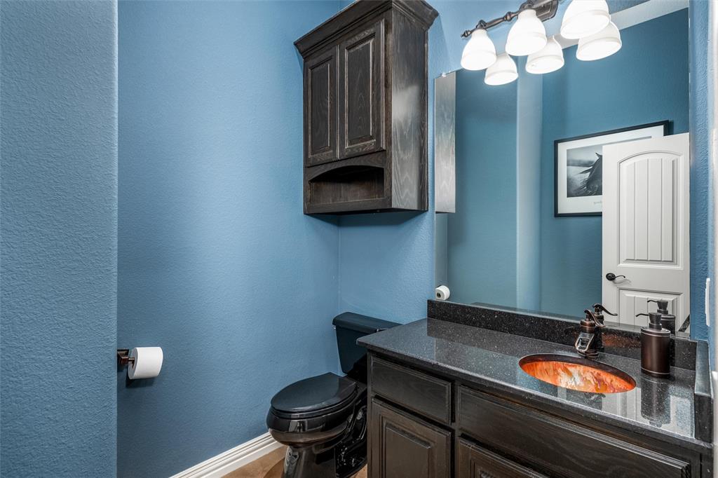 5033 Brook Lane Anna, TX 75409 - Photo 16 of 35 a view of a bathroom with a sink and a mirror
