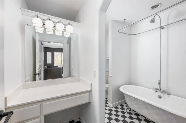 a bathroom with a sink a mirror and a toilet