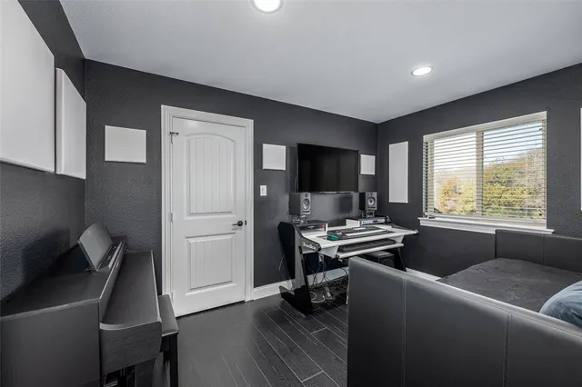 a view of a livingroom with furniture and a window