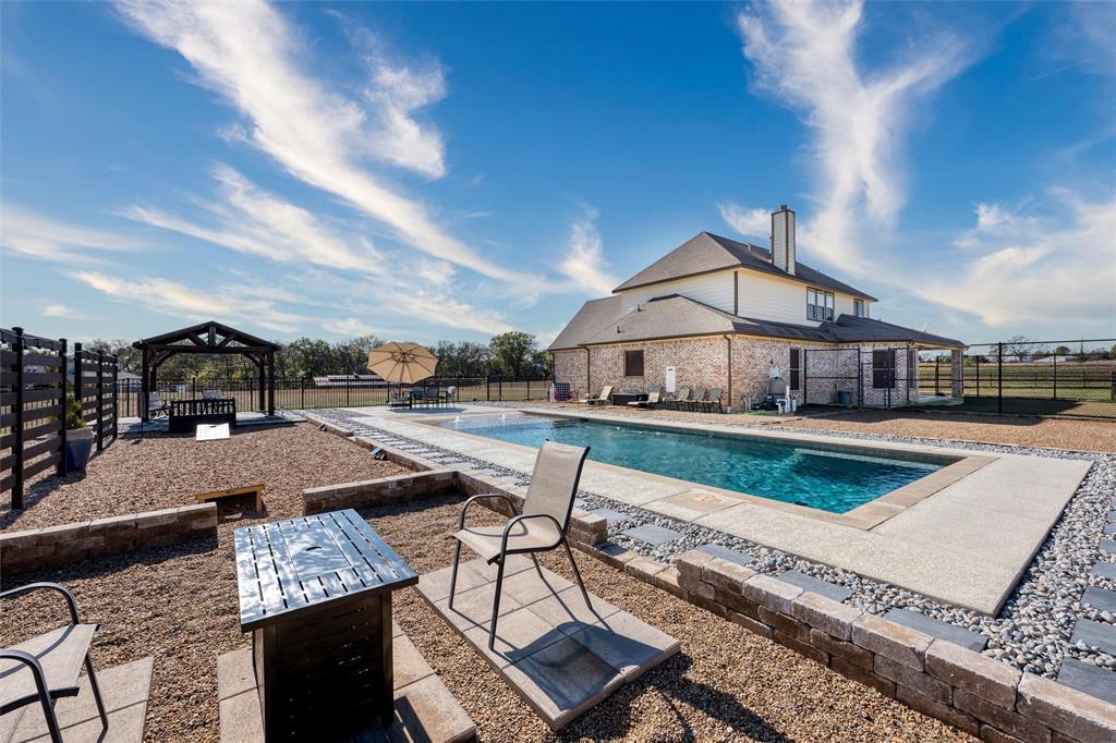 5033 Brook Lane Anna, TX 75409 - Photo 26 of 35 a view of a house with pool and chairs