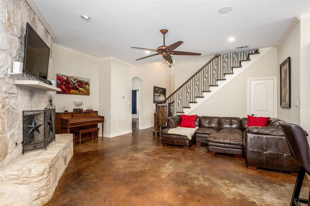 5033 Brook Lane Anna, TX 75409 - Photo 7 of 35 a living room with furniture and a flat screen tv