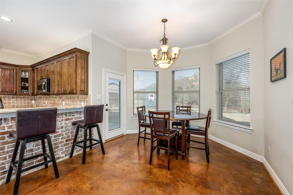 5033 Brook Lane Anna, TX 75409 - Photo 8 of 35 a view of a dining room with furniture window and wooden floor