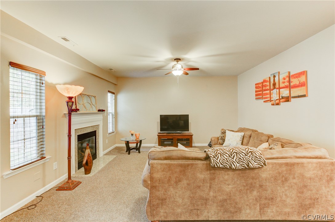 3602 Avocado Drive Midlothian, VA 23112 - Photo 17 of 39 a living room with furniture fireplace and flat screen tv