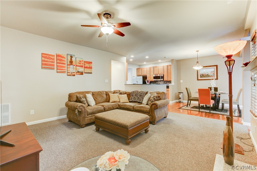 3602 Avocado Drive Midlothian, VA 23112 - Photo 18 of 39 a living room with furniture kitchen view and a chandelier