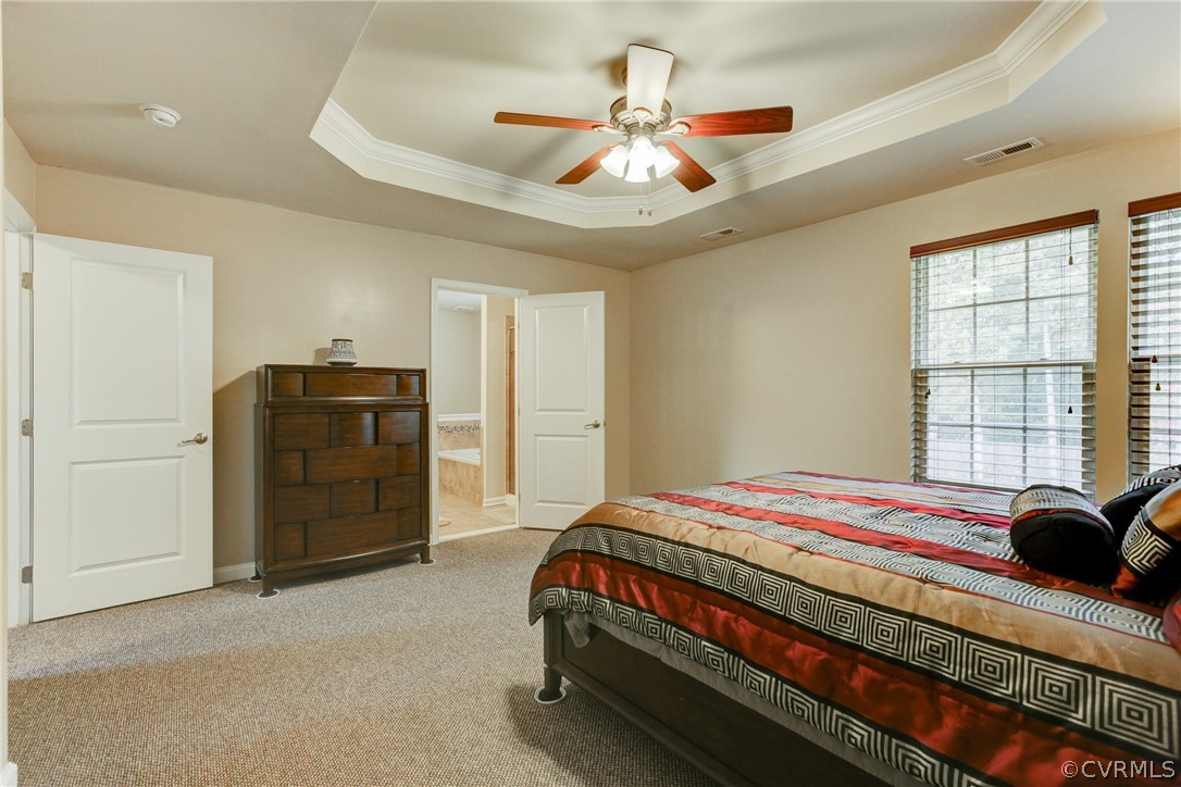 3602 Avocado Drive Midlothian, VA 23112 - Photo 31 of 39 a bedroom with a bed and a chandelier