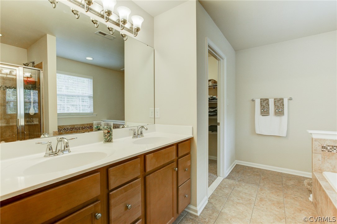 3602 Avocado Drive Midlothian, VA 23112 - Photo 32 of 39 a bathroom with a double vanity sink a mirror and a shower