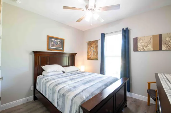 a bedroom with a bed and a table in it