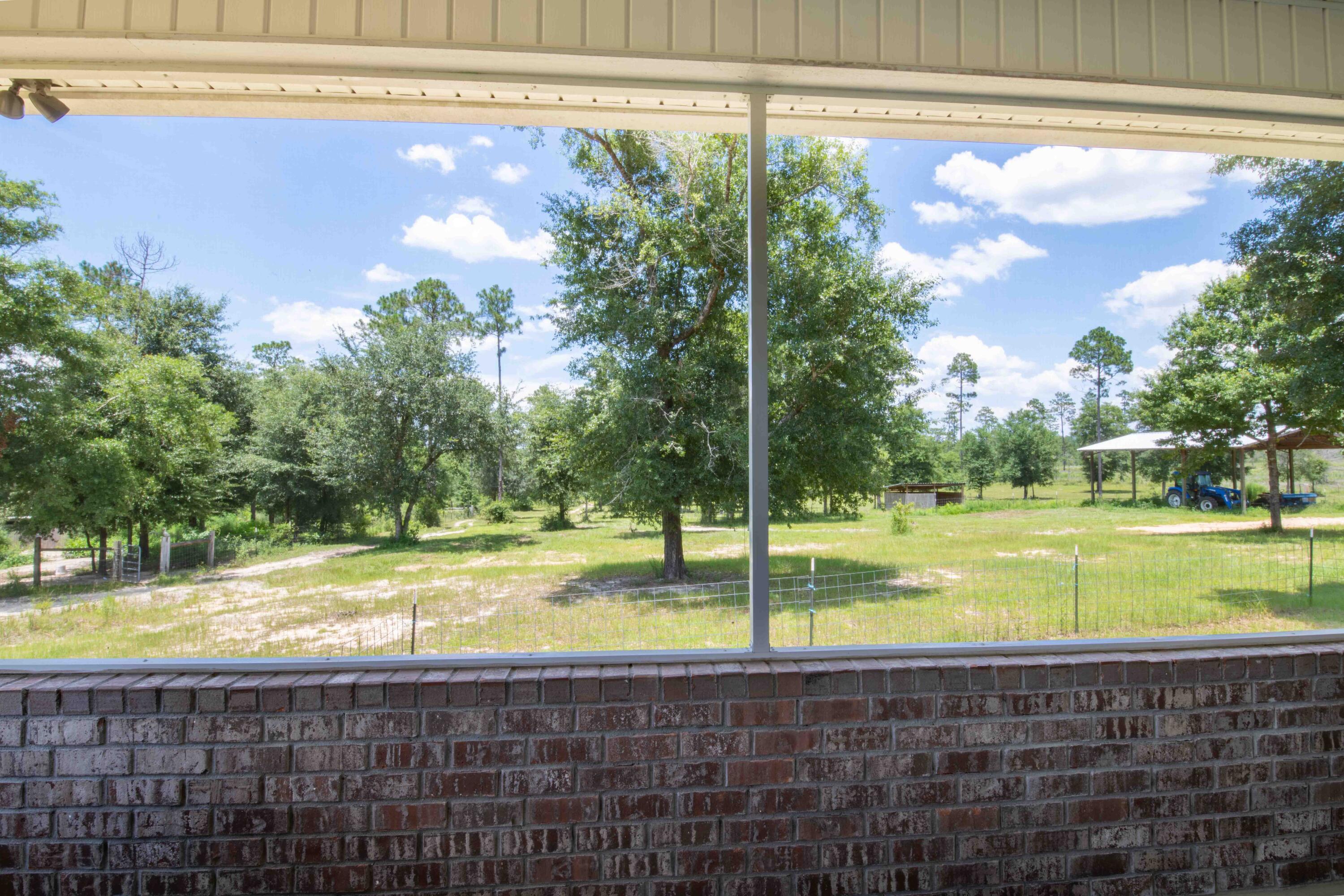6249 Highway 4 Baker, FL 32531 - Photo 17 of 37 a view of an outdoor space and swimming pool